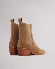 The Joni. A Chelsea boot designed to be worn with any pant leg shape from day to night. Our ankle boot is crafted in suede with a squared-off pointed toe and features elasticized gores and back pull tabs. Crafted with dual-density antimicrobial foam insoles: OrthoLite® Lazy-Hybrid™ for custom-fit comfort, and OrthoLite® Recycled for stability and support. Camel Suede 40 Royalty Clothing, Beige Skin, Womens Booties, Women Footwear, Cardigan Design, Designer Boots, Chelsea Boot, Prince Harry, Rag & Bone