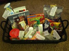 a basket filled with lots of different items on top of a carpeted floor in front of a door