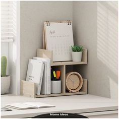 a desk with a calendar, clock and other office supplies