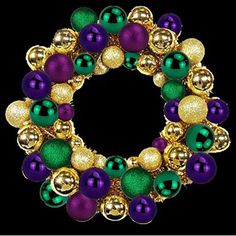 a gold and green christmas wreath with ornaments