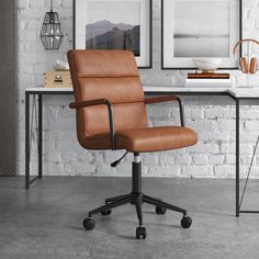 a brown office chair sitting in front of a white brick wall