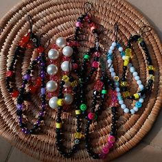 a wicker basket filled with lots of different colored beads