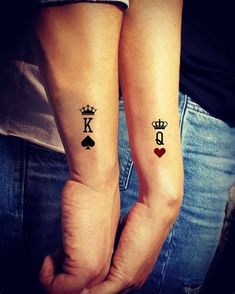 two people with matching tattoos on their arms