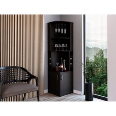 a black cabinet with wine glasses on it and a chair next to it in front of a window