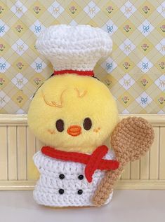 a stuffed chicken wearing a chef's hat and scarf