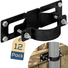 a pair of black metal brackets are attached to the side of a wooden door with two tags