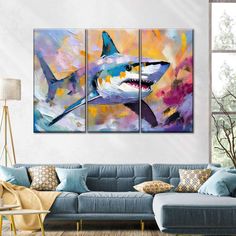 three pieces of artwork on the wall in a living room with couch and coffee table