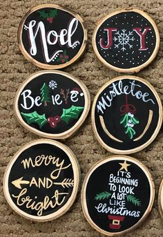 six decorated christmas cookies on top of a brown carpeted floor next to each other