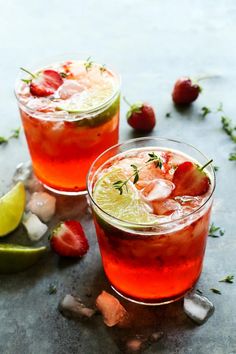 two glasses filled with strawberry lemonade and lime