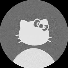 a black and white photo of a hello kitty in a circle with the word hello kitty on it