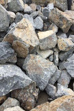 large rocks are piled together on the ground