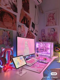 two computer monitors sitting on top of a desk next to each other with anime wallpapers behind them