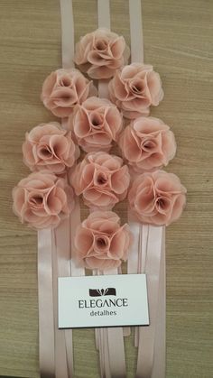 a bunch of pink flowers sitting on top of a table