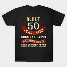 a black shirt with the words built 50 years ago and most likely good working order