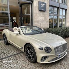 a white car parked in front of a building