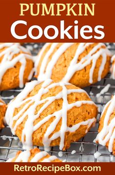 pumpkin cookies with white icing on a cooling rack