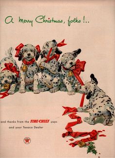 a group of dalmatian dogs sitting next to each other on top of a christmas card