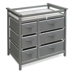 a grey dresser with six drawers and two baby changing tables