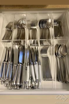 a drawer full of silverware and utensils