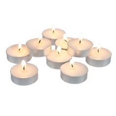 white tealight candles are arranged in a circle