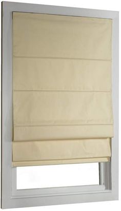 a beige roman blind in a window