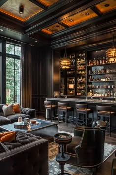 a living room filled with furniture and a bar