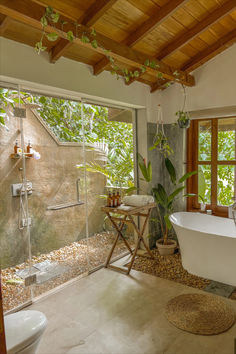 a bathroom with a tub, sink and shower