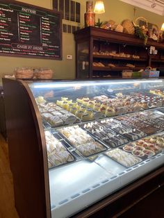 a display case filled with lots of desserts