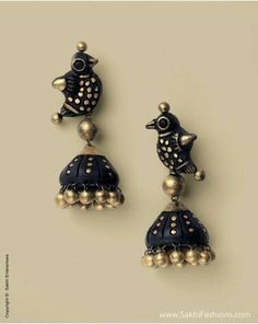 two pairs of blue and gold earrings with birds on it's ear ends, one in the shape of a bell