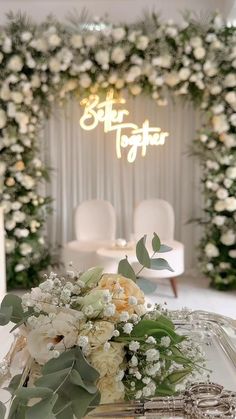 flowers and greenery are arranged in front of a sign that reads, star together