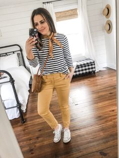 10 ways to style mustard pants. - dress cori lynn Mustard Pants Outfit Spring, Mustard Trousers Outfit, Mustard Jeans Outfit, Gold Pants Outfit, Mustard Outfit, Postpartum Wardrobe, White Striped Shirt Outfit, Yellow Pants Outfit