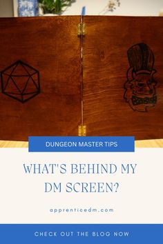 a wooden box with the words, what's behind my dm screen?