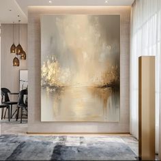 a large painting hanging on the wall in a living room next to a dining room table