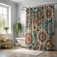 a bathroom with a flower shower curtain next to a bathtub