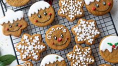 gingerbread cookies decorated with icing on a cooling rack