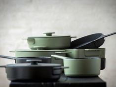 pots and pans are stacked on top of each other