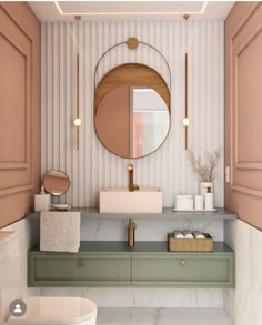 a bathroom with a sink, toilet and mirror on the wall next to it is decorated in pastel colors