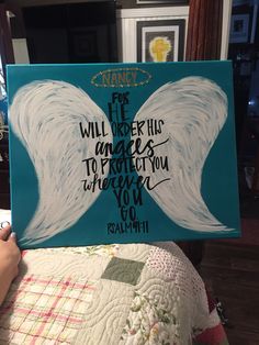 a person holding up a sign with an angel on it that says for the will be his angels to protect you wherever you go