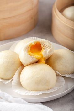 steamed egg custard buns on a white plate