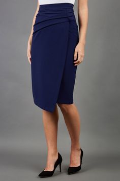 model is wearing diva catwalk antibe pencil asymmetric skirt with pleating at the front in navy front Skirt Pencil, Knee Length Skirt Pencil, Asymmetrical Skirt, Crepe Fabric, Knee Length Skirt, Pencil Skirt, Knee Length, England