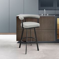 a modern bar stool in front of a kitchen counter