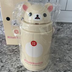 a plastic cup with a bear face on it