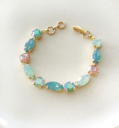 Gorgeous bracelet featuring alternating 8mm round and 15x7mm marquise crystals in shades of mint opal and pink. Bracelet is 7 inches long. Thanks for stopping by! Green Wedding Jewelry, Mint Green Wedding, Bracelet Simple, Etsy Bridesmaid Gifts, Wedding Jewelry Bracelets, Gorgeous Bracelet, Rhinestone Bracelet, Pink Bracelet, Crystal Bracelet