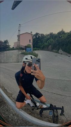 a woman taking a selfie on her bike