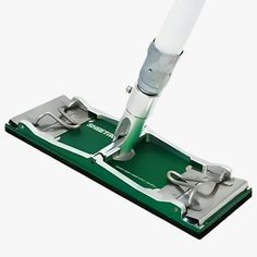 a green and white mop on top of a floor