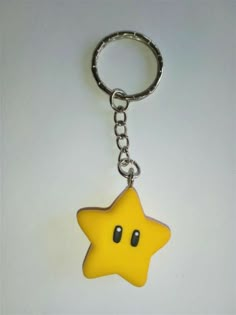 a yellow star shaped keychain sitting on top of a white table