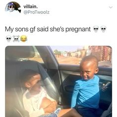 two children sitting in the back seat of a car