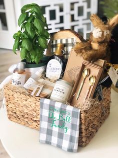 a basket filled with items sitting on top of a table next to a potted plant