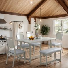 a white table and chairs in a room