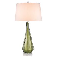 a green glass table lamp with a white shade